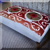 F16. Upholstered cocktail ottoman with embroidery. 16”h x 51”w x 32”d 
